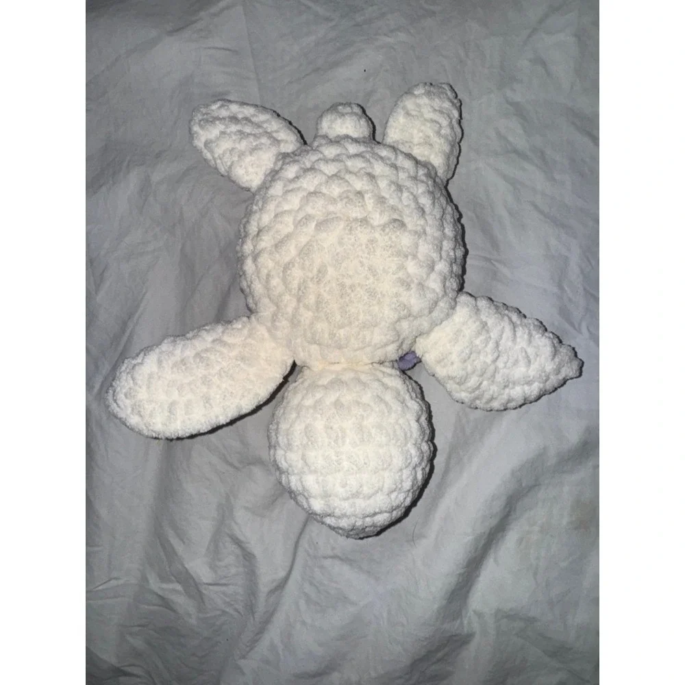 Hand crocheted‎ baby sea turtle white body and lilac purple shell.